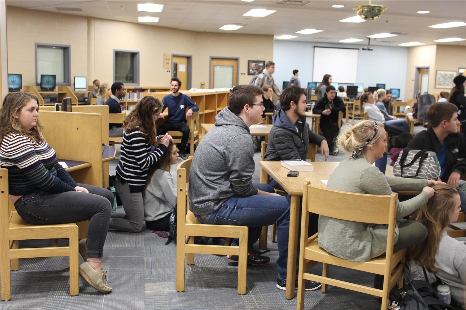 An early morning Student Council meeting in the library